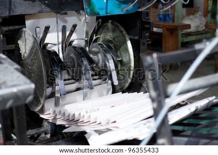 ready newspaper on production line in a print shop