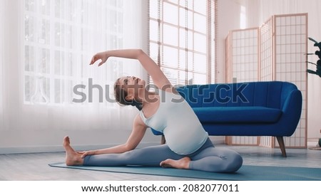 Similar – Image, Stock Photo Pregnant woman exercising with personal trainer