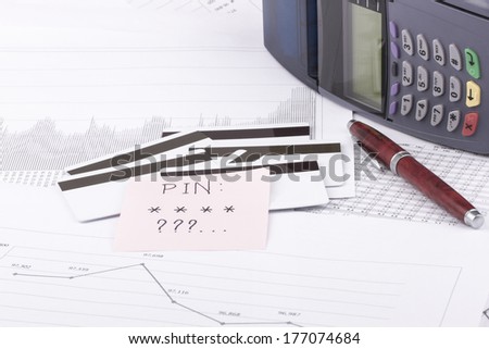 Business still-life of a payment terminal, pen, cards, sticker, eyeglasses