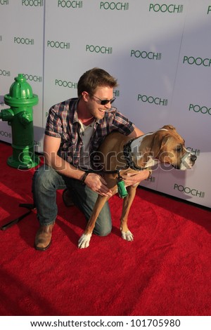 LOS ANGELES, CA - MAY 3: Kaj-Erik Eriksen, dog Hazel at the grand opening of the Pooch Hotel on May 3, 2012 in Hollywood, Los Angeles, California. The Pooch Hotel is a luxury hotel for dogs.