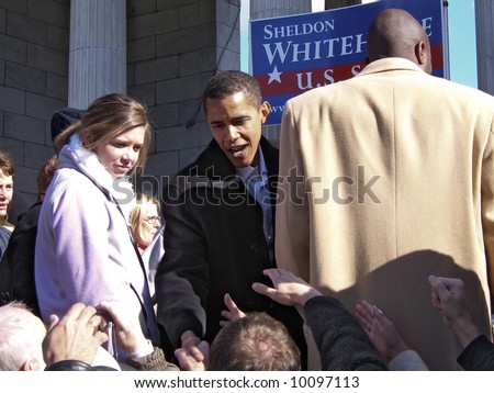 Barack Obama shaking hands at a political rally for Senator Sheldon Whitehouse in Providence, Rhode Island, on November 18, 2006.