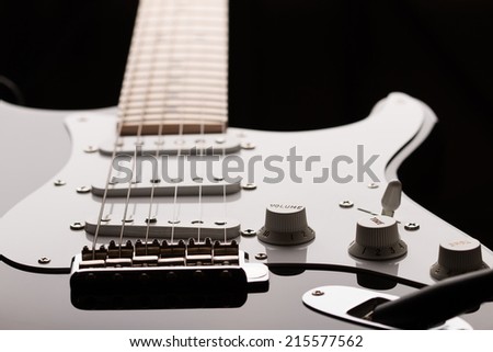 Electric guitar in dark key at unusual angle