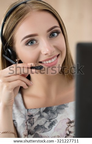 Portrait of beautiful call center operator at work