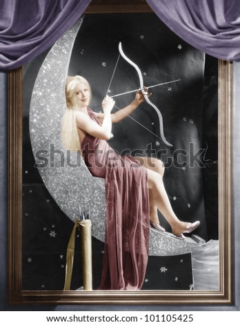 Woman sitting on crescent moon with bow and arrow