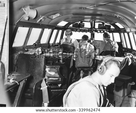 The bridge deck or cabin of the 82-ton Douglas B-19, the world's largest bomber. Nov. 13, 1941. With backs to camera are the pilot, flight engineer, and co-pilot. The radioman is at lower right. The t Photo stock © 