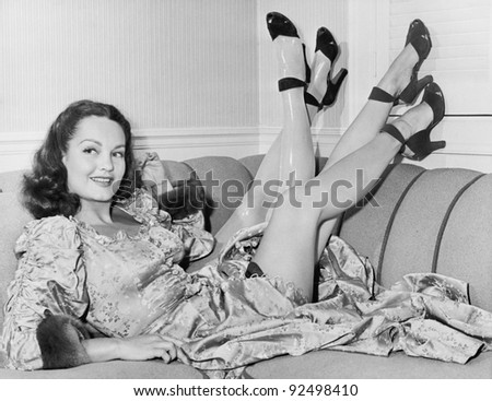 Always nice to have a spare, a young woman sits on her sofa with four legs