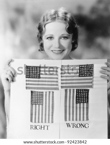 Young woman holding a diagram of how to hang an American Flag