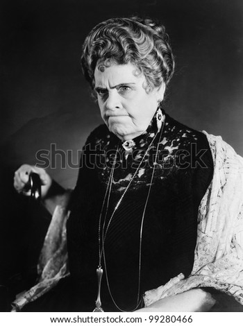 A Very Stern Looking Woman Holding Onto Her Cane Stock Photo 99280466 ...