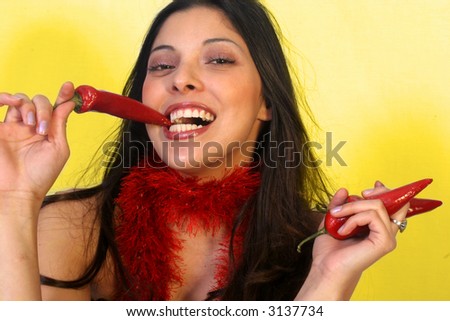 Beautiful Hispanic Woman Eating Chili-Peppers