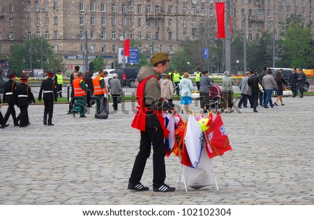 MOSCOW, RUSSIA -  MAY 09: A souvenirs seller in soldier uniform. Victory Day celebration on Poklonnaya Hill (Moscow) on May 09, 2012 in Moscow, Russia.