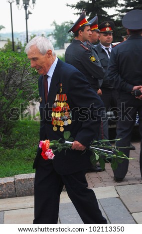 MOSCOW, RUSSIA - MAY 09: A soldier veteran with flowers. Victory Day celebration on Poklonnaya Hill (Moscow) on May 09, 2012 in Moscow, Russia.