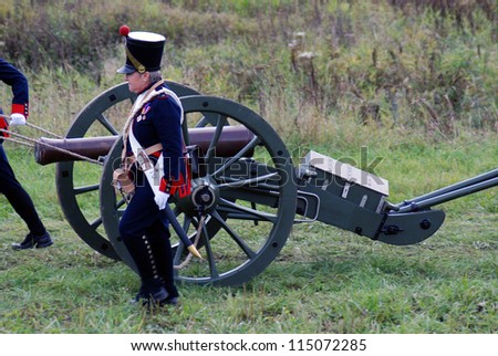 MOSCOW REGION - SEPTEMBER 04: Unknown soldiers with a cannon at Borodino historical reenactment battle between Russians and Frenchmen. Taken on September 04, 2011 in Borodino, Moscow Region, Russia.