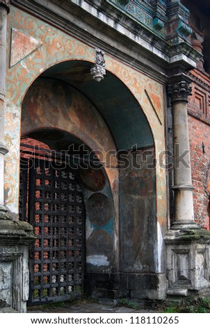 Krutitskoye podvorye (courtyard) - famous landmark and historical place in Moscow, Russia. Arch of entrance gates decorated by painting and columns.