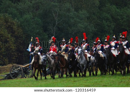 MOSCOW REGION - SEPTEMBER 02: Men dressed as 1812 Russian and French soldiers riding horses re-enacting a staged Borodino battle eposides on September 02, 2012 in Borodino, Moscow Region, Russia.
