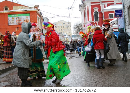 MOSCOW, RUSSIA - MARCH 16: People dancing on the street. Shrovetide celebration in Moscow city center. Taken on March 16, 2013 in Moscow, Russia.