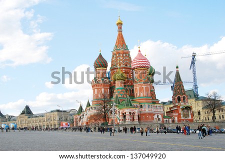 MOSCOW, RUSSIA - MAY 01: People walking on the Red Square decorated for May holidays. Saint Basil Church. Spring and Labor Day celebration on May 01, 2013 in Moscow, Russia.