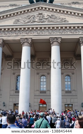 MOSCOW, RUSSIA - MAY 09: War veterans sing war songs on the Theater Square; by the Bolshoi Theater, traditional place for veterans\' meeting. Taken on May 09, 2013 in Moscow.