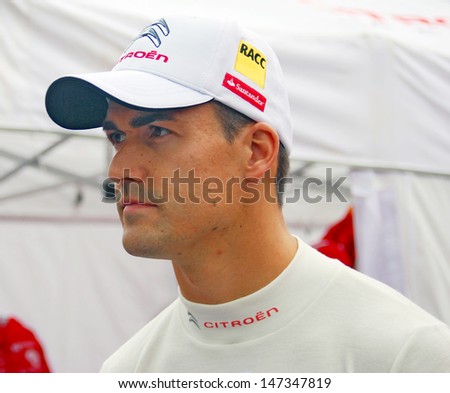 MOSCOW - JULY 20: Rally driver Dani Sordo (WRC team) at Moscow City Racing. Formula 1 teams show in historical city center of Moscow. Taken on July 20, 2013 in Moscow, Russia.