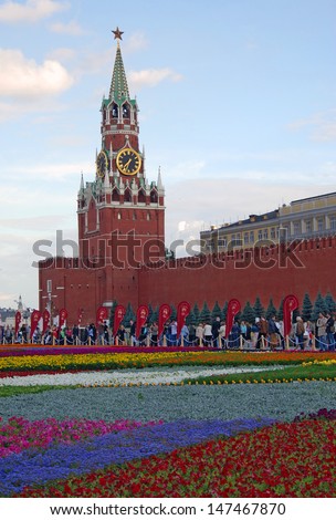 MOSCOW - JULY 23: 4000 square meters of different flowers put on the Red Square on the occasion of 120th anniversary of GUM - State Department store opening. Taken on July 23, 2013 in Moscow.