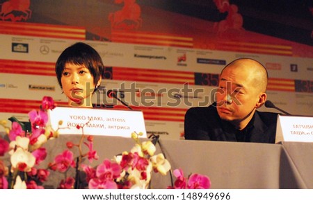 MOSCOW - JUNE 28: Japanese actress Yoko Maki and film director Tatsushi Oomori at the press-conference of a film  Ravine of goodbye at 35 Moscow International Film Festival on June 28, 2013 in Moscow.