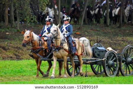 MOSCOW REGION - SEPTEMBER 02: Reenactors (man and woman) dressed as Napoleonic war soldiers ride horses on September 02, 2012 in Borodino, Moscow Region, Russia. They reenact  Borodino (1812) battle.