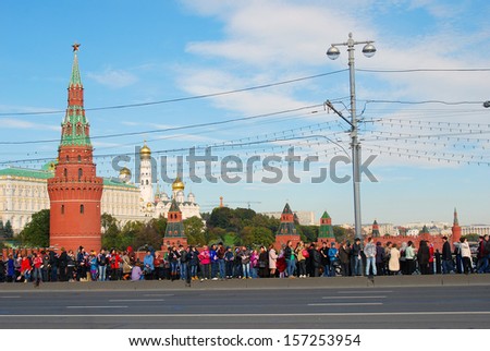 MOSCOW - OCTOBER 06: Many people stand on the Big Stone bridge and greet Olympic flame arrival to Moscow, preparation to Sochi-2014 Olympic games. Taken on October 06, 2013 in Moscow.