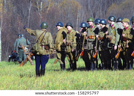 MOSCOW REGION - OCTOBER 13: A commander gives orders. Reenactors dressed as WW II soldier on October 13, 2013 in Borodino, Moscow Region, Russia. They reenact the Moscow Battle held in 1941.