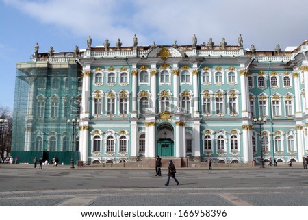 SAINT-PETERSBURG, RUSSIA - MARCH 23: People walk on Dvortsovaya Square, by the Hermitage museum. UNESCO World Heritage Site. Taken on March 23, 2013 in Saint-Petersburg, Russia.