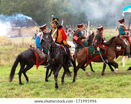 MOSCOW REGION - SEPTEMBER 4: Reenactors dressed as Napoleonic war soldiers ride horses on September 4, 2011 in Borodino, Moscow Region, Russia. They reenact the Borodino battle held in 1812.
