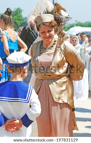 MOSCOW - JUNE 08, 2014: Portrait of dancing people in historical costumes. Times and Ages International Historical Festival in Kolomenskoye park, Moscow.