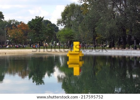 MOSCOW - SEPTEMBER 06, 2014: A wooden bird (duck) sculpture. View of the Gorky park in Moscow city center. A popular touristic landmark and place for walking.