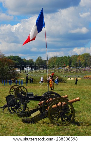MOSCOW REGION - SEPTEMBER 07, 2014: View of a French camp before the battle. French flag. Old cannons. Borodino battle historical reenactment.