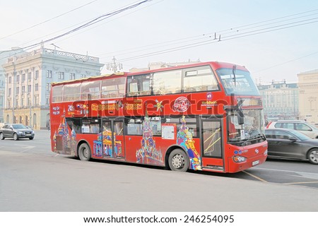 MOSCOW - JANUARY 22, 2015: View of a red double decker excursion bus in the Moscow city historic center in winter. It\'s a popular touristic place for walking.