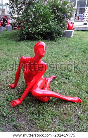 MOSCOW - MAY 27, 2015: Red plastic woman figure shown in Moscow, by the Central House of Artists - famous landmark.