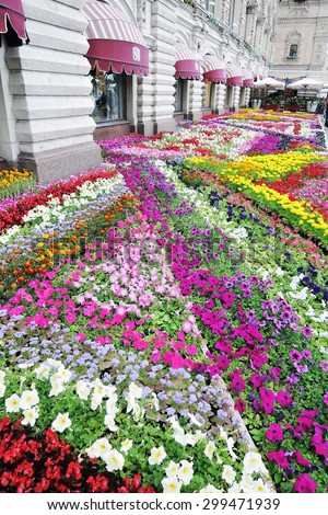 MOSCOW - JULY 23, 2015: Flowers on the Red Square in Moscow, by GUM building. Summer decoration. Red Square is a UNESCO World Heritage Site.