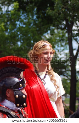 MOSCOW - JUNE 06, 2015: Persons in historical costumes at historical festival Times and Ages. Ancient Rome in Kolomenskoye park, Moscow.