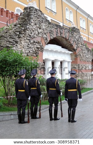 MOSCOW - JUNE 28, 2015: Guard of honor in Alexander\'s garden in Moscow, by Moscow Kremlin walls. Eternal flame war memorial. Popular landmark.