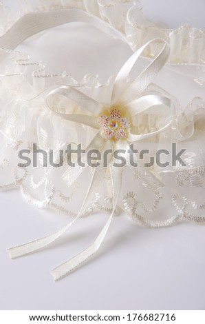 Beautiful lace wedding garter with a bow.