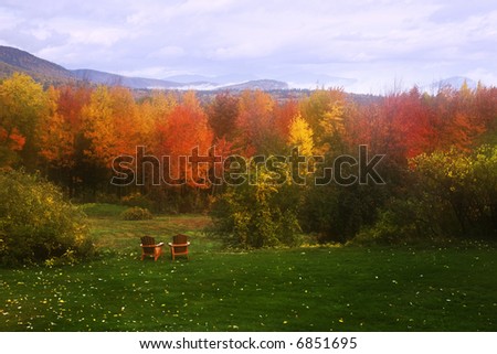 Pair of lawn chair contemplating an early morning fall scenery in the White mountains