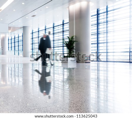 people silhouette in hall of office building