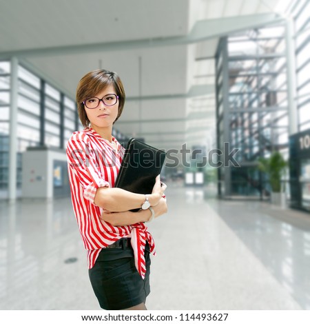 Young business woman on the background of a modern airport