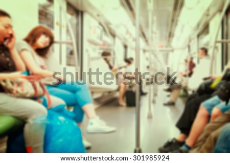 Blurred abstract background in vintage style of people commuting on Tokyo subway train