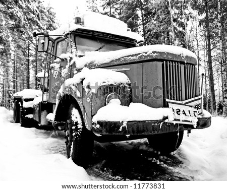 old broken truck left behind in the snow