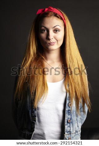 Girl with red hair with funny grimace