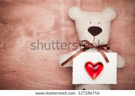 Vintage valentine card with handmade bear and heart on wood
