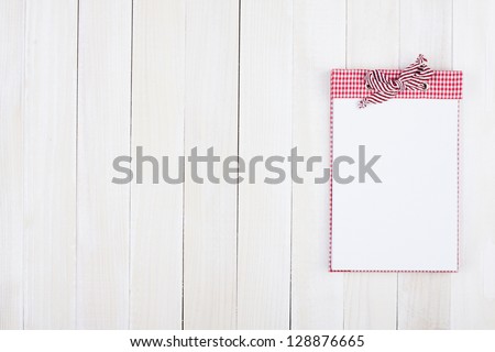 Notebook on white wood background