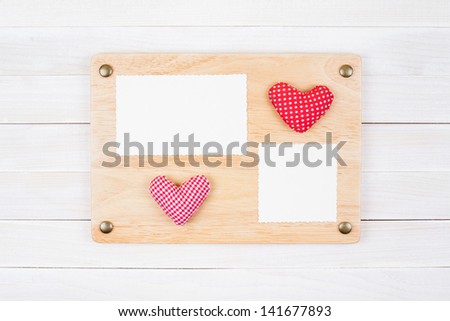 Photo frame board, love heart on white wood background