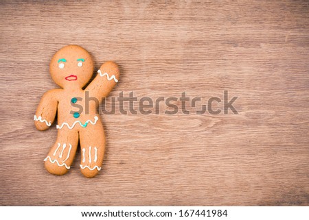 Gingerbread Man on wood. Christmas card background