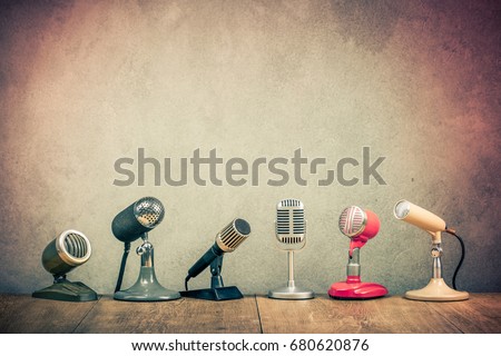 Retro old microphones for press conference or interview on wooden desk. Vintage instagram style filtered photo Stockfoto © 