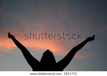 Female silhouette experiencing summer\'s freedom